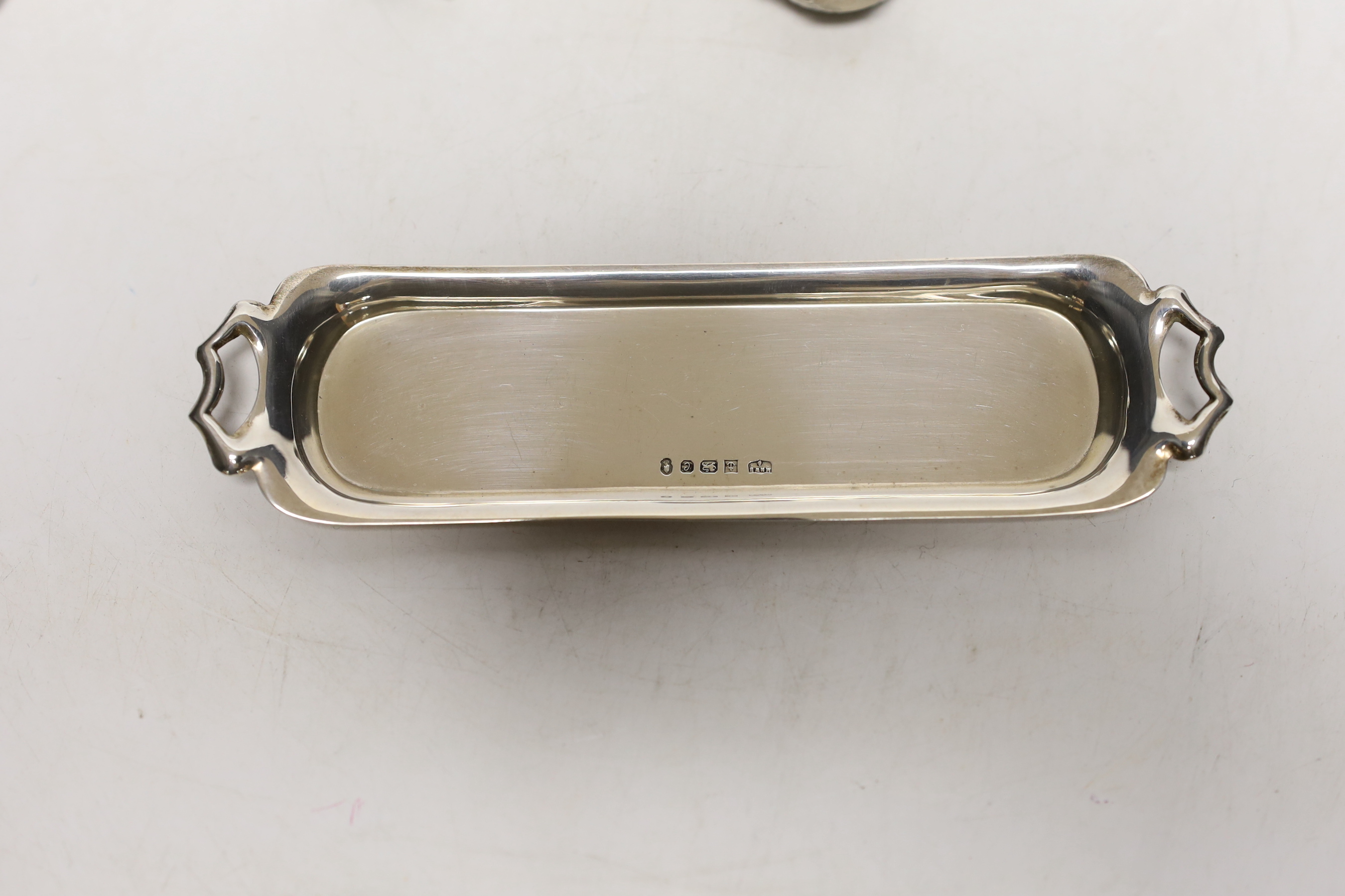 An Elizabeth II silver miniature four piece tea set and two handled tea tray, by Mappin & Webb, London, 1977, tray 14.9cm.